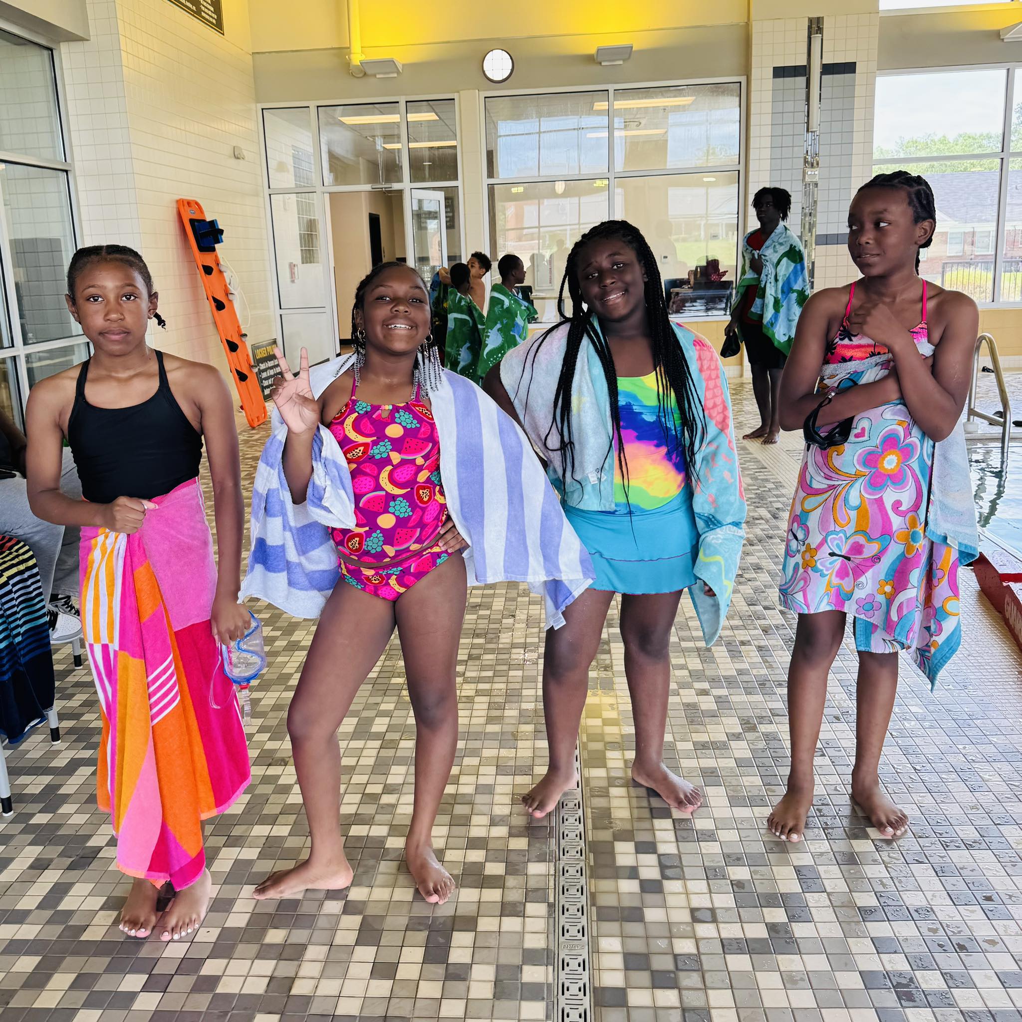 Four girls posing for a picture.